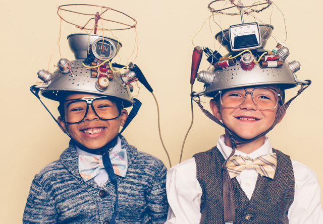 Two young boys dressed in homemade astronaut helmets